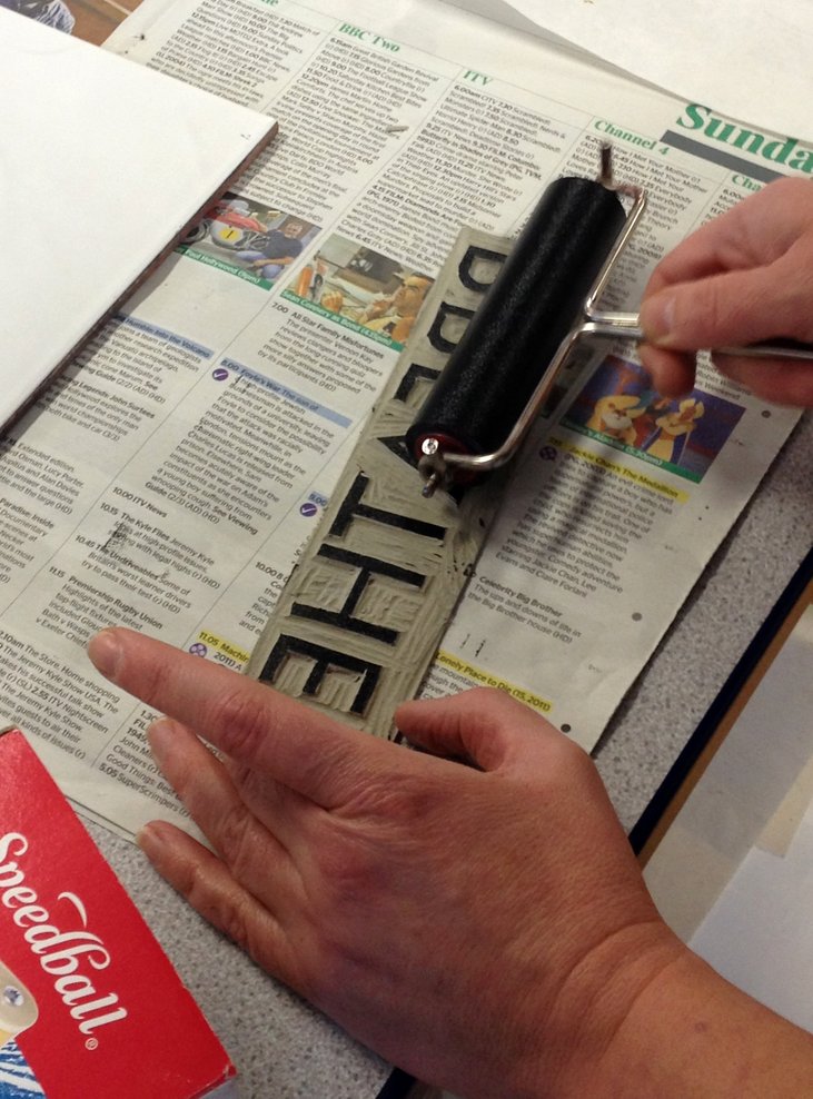 Cutting and printing letters in lino 